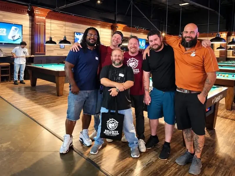 Dads at a Dadlympics event posing for a group photo
