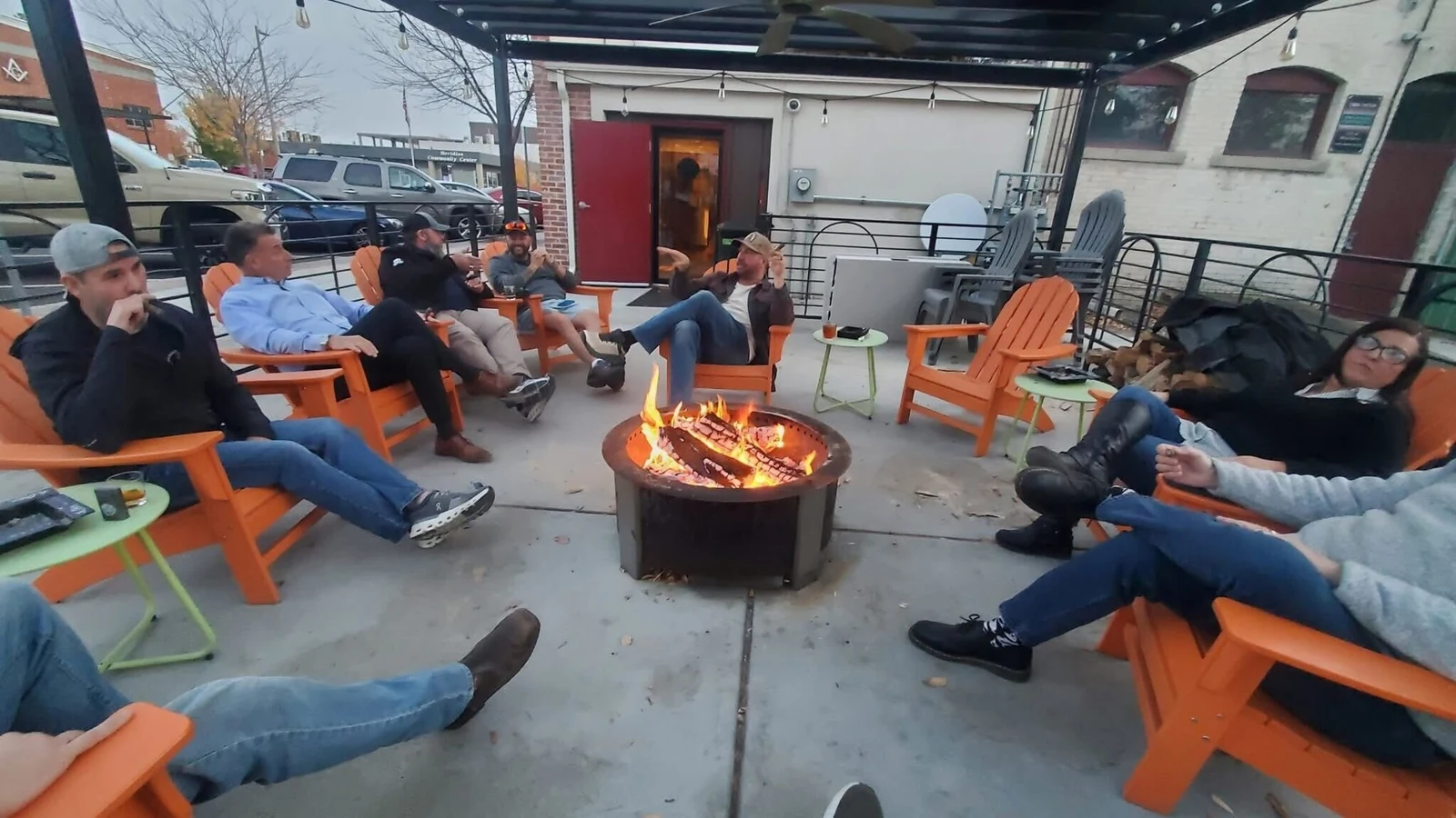 Dads talking around a fire during a real Dad Tribes gathering