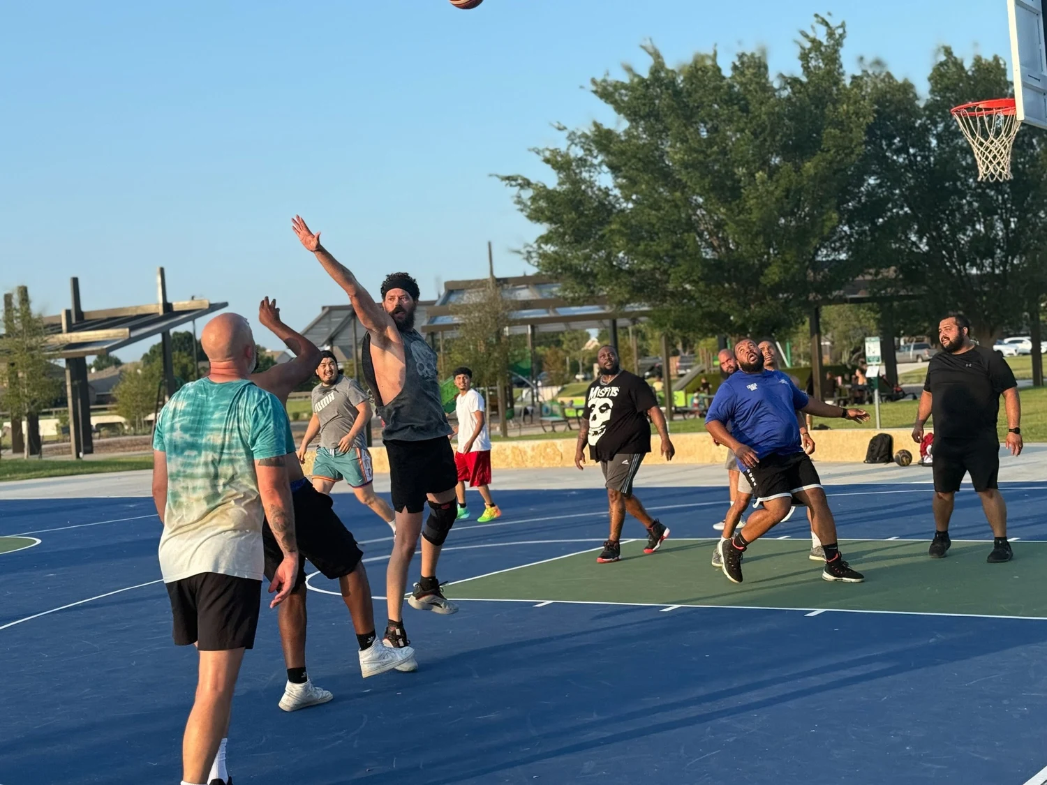 Dads playing basketball together at a real Dad Tribes gathering